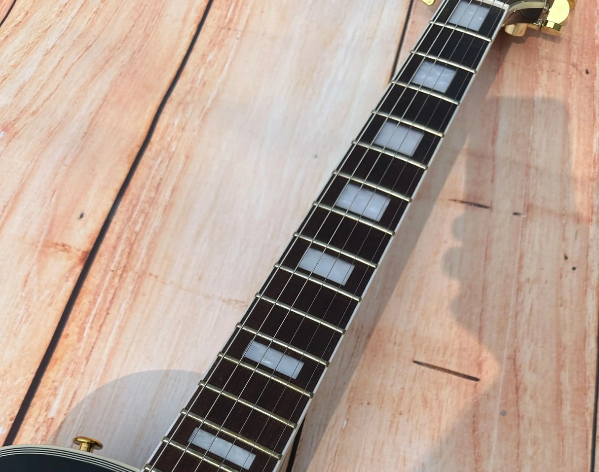 Customized electric guitar, black shiny, gold accessories, imported
