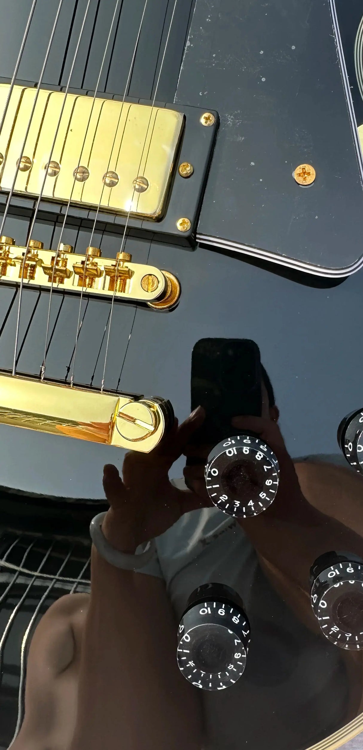 Customized electric guitar, black shiny, gold accessories, imported
