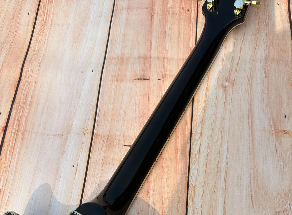 Customized electric guitar, black shiny, gold accessories, imported