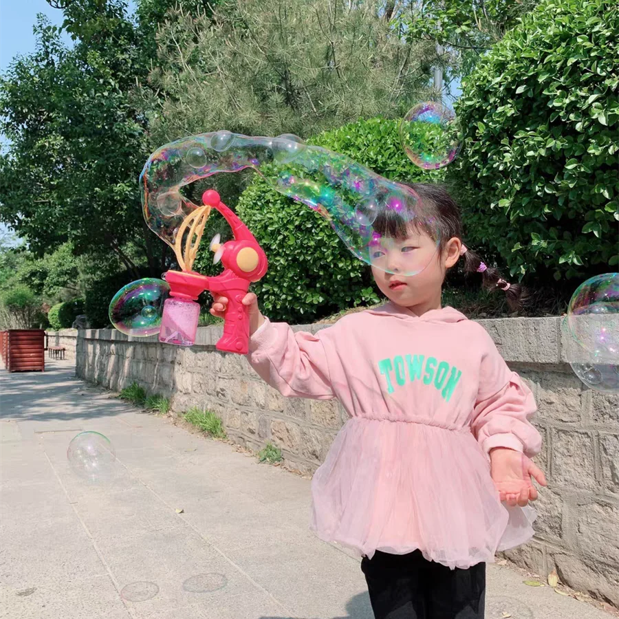 Bubble in Bubble Gun Machine Blowing Electric Bubbles